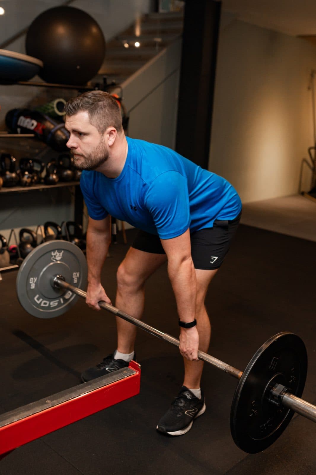 Client performing a deadlift during a personal training session in Clapham